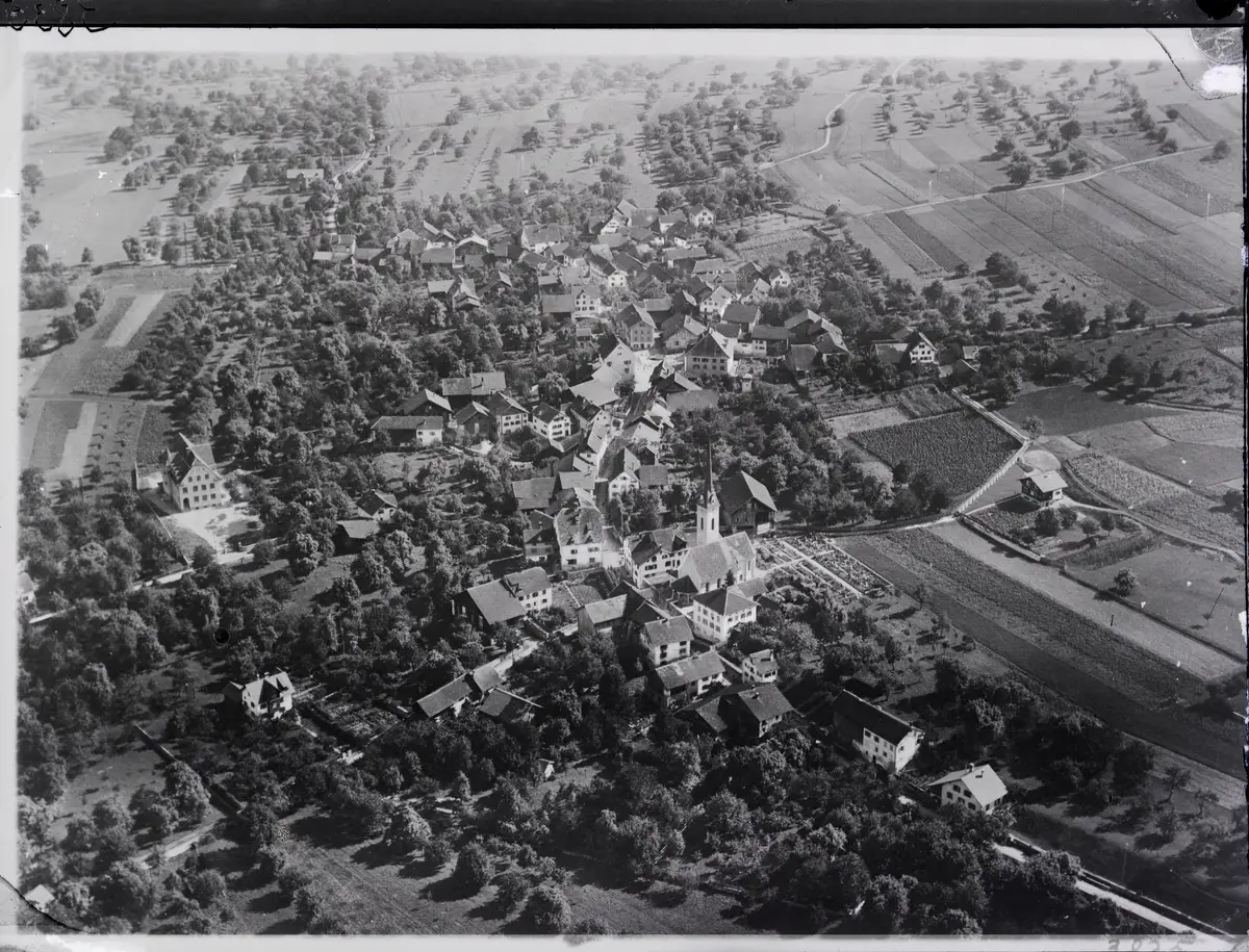 Igis from the west, from 400 m, 1923: the village and its Reformed church, where the Igis Hegnauers were baptised, married and buried, among orchards and…