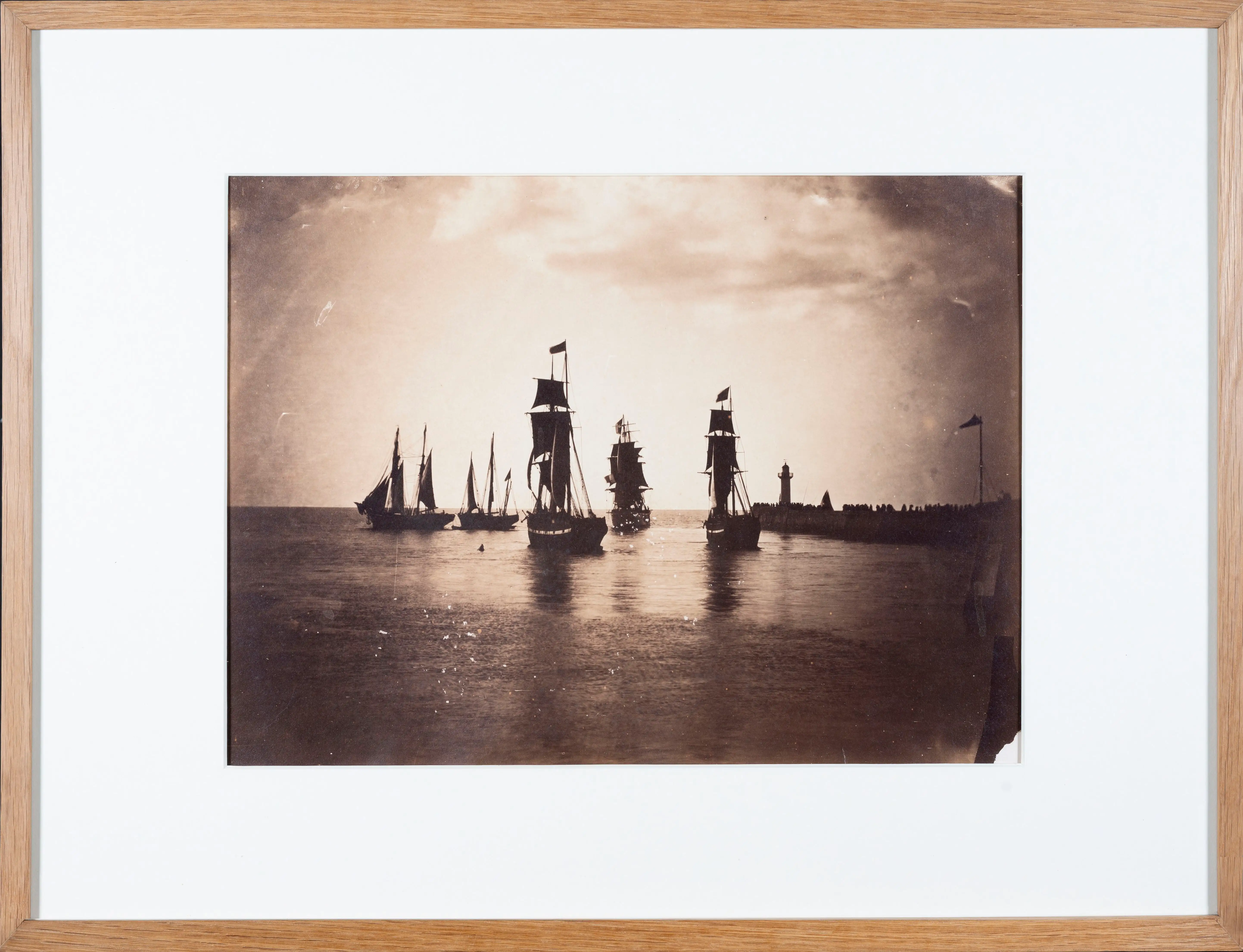 Gustave Le Gray, Bateaux quittant le port du Havre , albumen print, 1856–57. Sailing ships leaving Le Havre past the jetty and lighthouse. Context: not the…